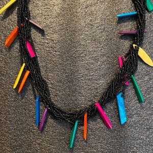 9 strand bead necklace with colored accents